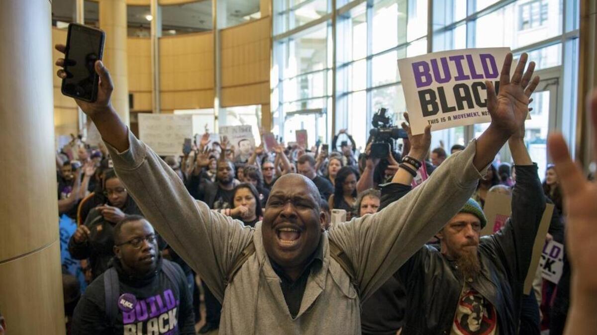 Protesters fill Sacramento City Hall in March, calling for economic justice after the police killing of Stephon Clark.