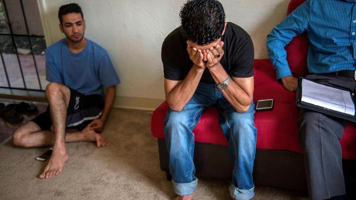 Afghan refugees Paiwastoon Hussain Khail, center, and Faisal Sediqi, left, were witnesses when a fellow refugee was shot in the face with a flare gun at a Sacramento County apartment complex.