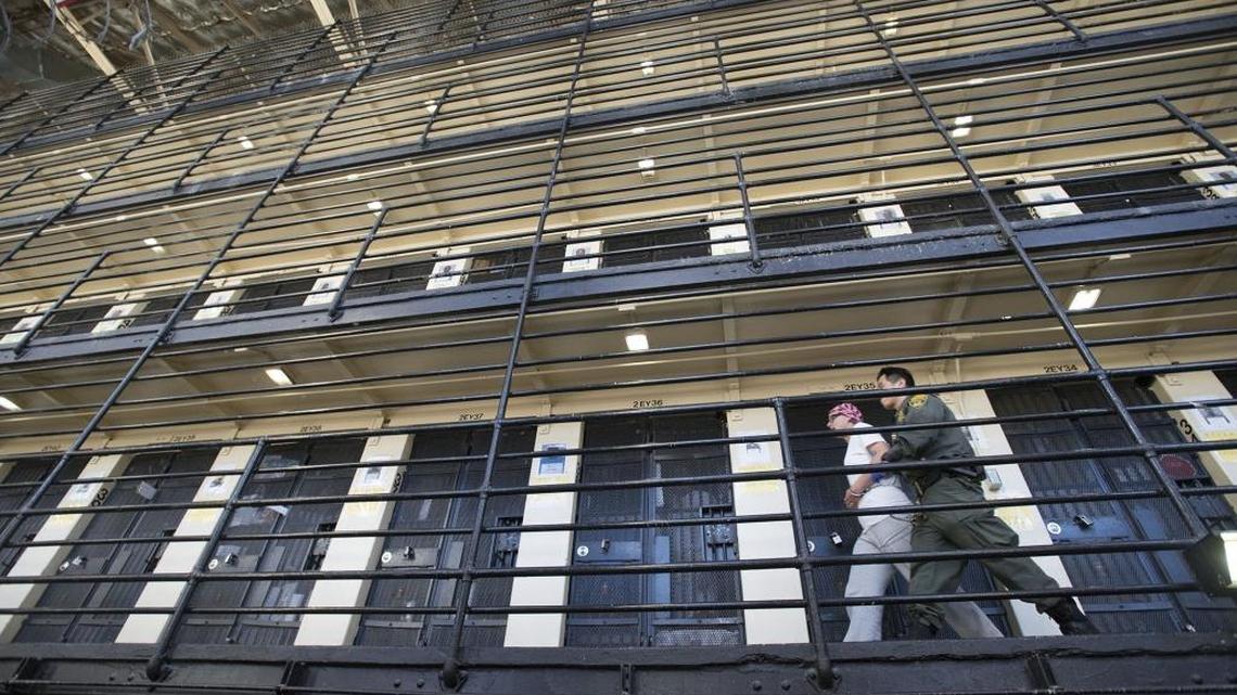 A corrections officer escorts an inmate back to his cell in East Block, a five-level facility that houses approximately 500 condemned inmates at San Quentin State Prison on Tuesday, December. 29, 2015, in San Quentin, Calif.