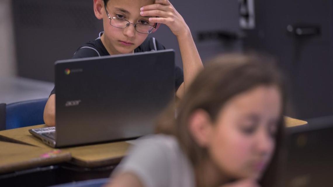 
Andrew De La Torre, 10, left, and Mandy Breault, 11, concentrate on a practice test earlier this year under new Common Core academic standards at Folsom Hills Elementary School. 
