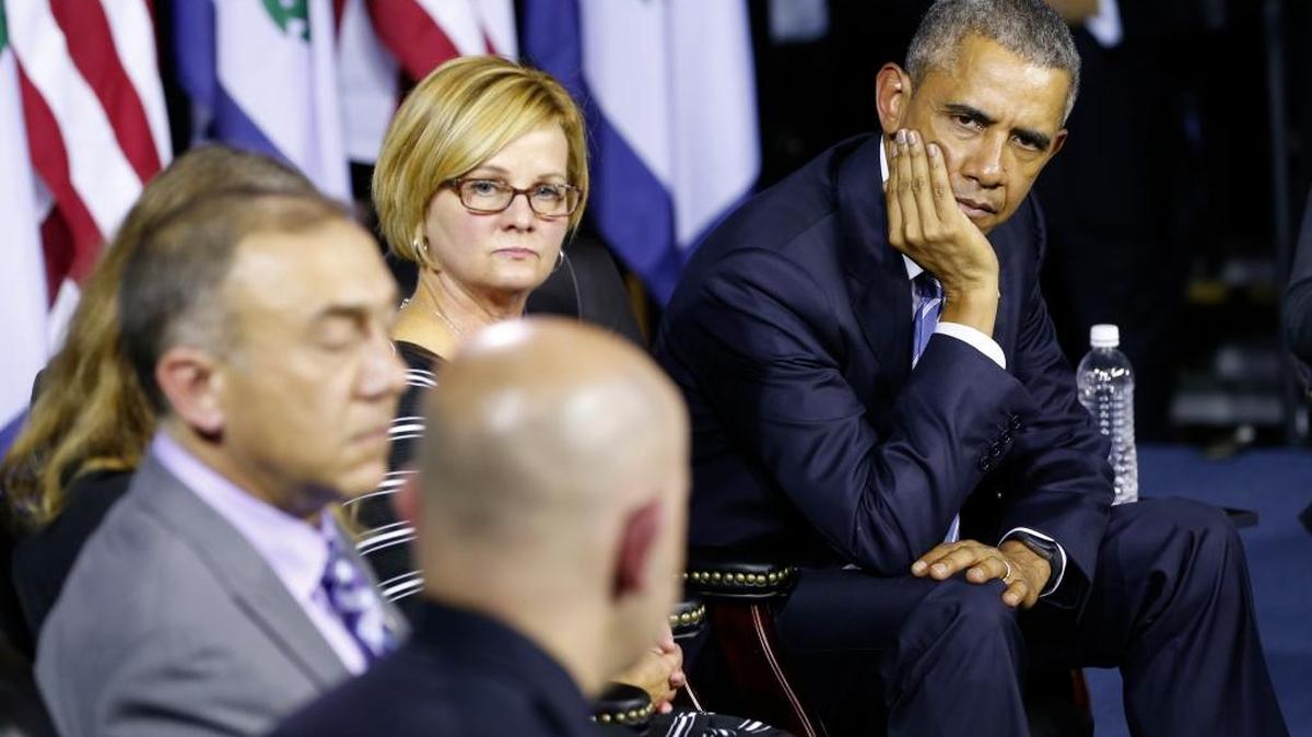 President Barack Obama listens during a community discussion Wednesday in Charleston, W.Va., on the prescription drug and heroin abuse epidemics.
