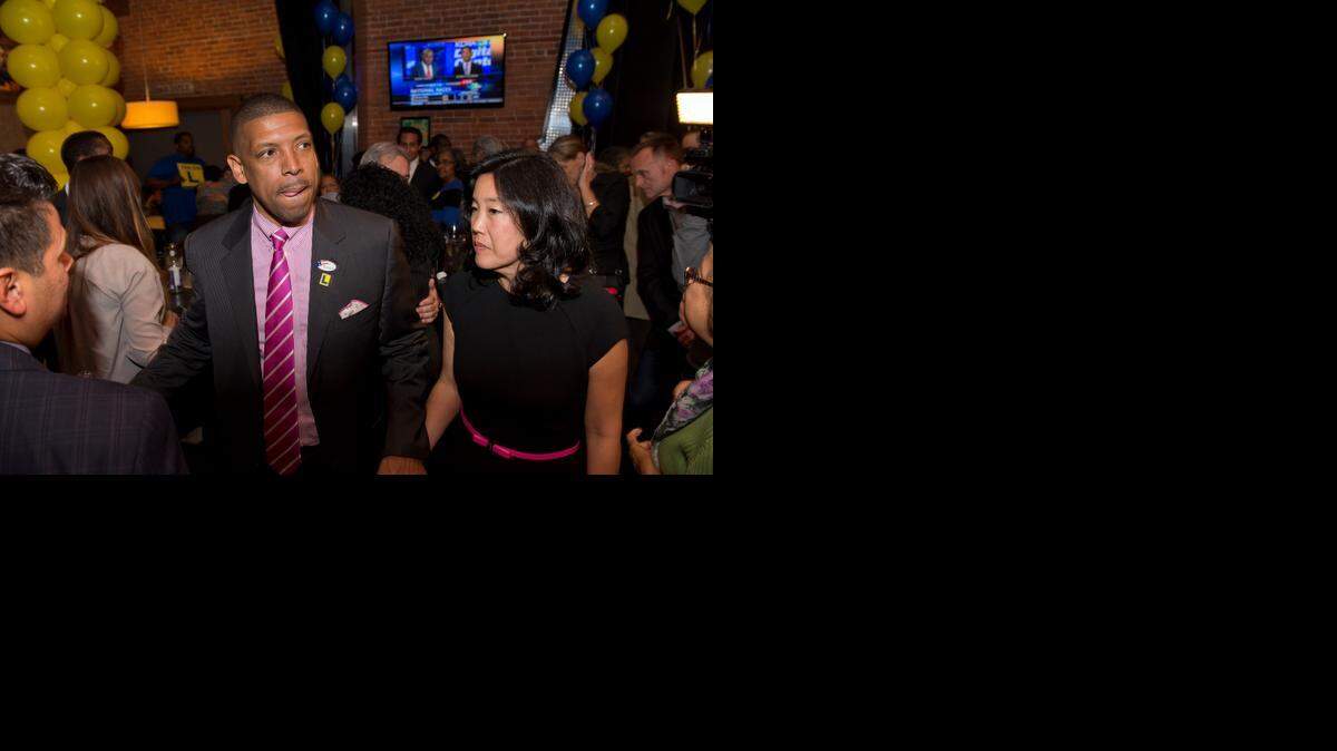 
Sacramento Mayor Kevin Johnson leaves with his wife, Michelle Rhee, after speaking to supporters of Measure L at Pizza Rock, in Sacramento on Tuesday.
