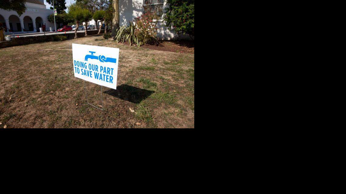 
A water-conservation sign is displayed outside City Hall in Santa Cruz. House Republicans are planning to pass an emergency drought-relief bill that would suspend state water rights and environmental law to maximize water deliveries to the Central Valley. 
