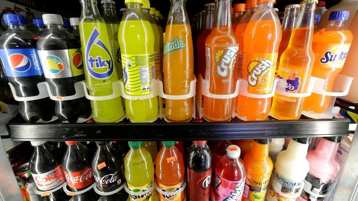 Soft drink and soda bottles are displayed in a refrigerator at El Ahorro market in San Francisco. In the wake of a rash of local soda taxes passed by Bay Area cities, the beverage lobby has pushed an initiative in California to raise the threshold for all local tax increases, alarming local governments. (AP Photo/Jeff Chiu, File)