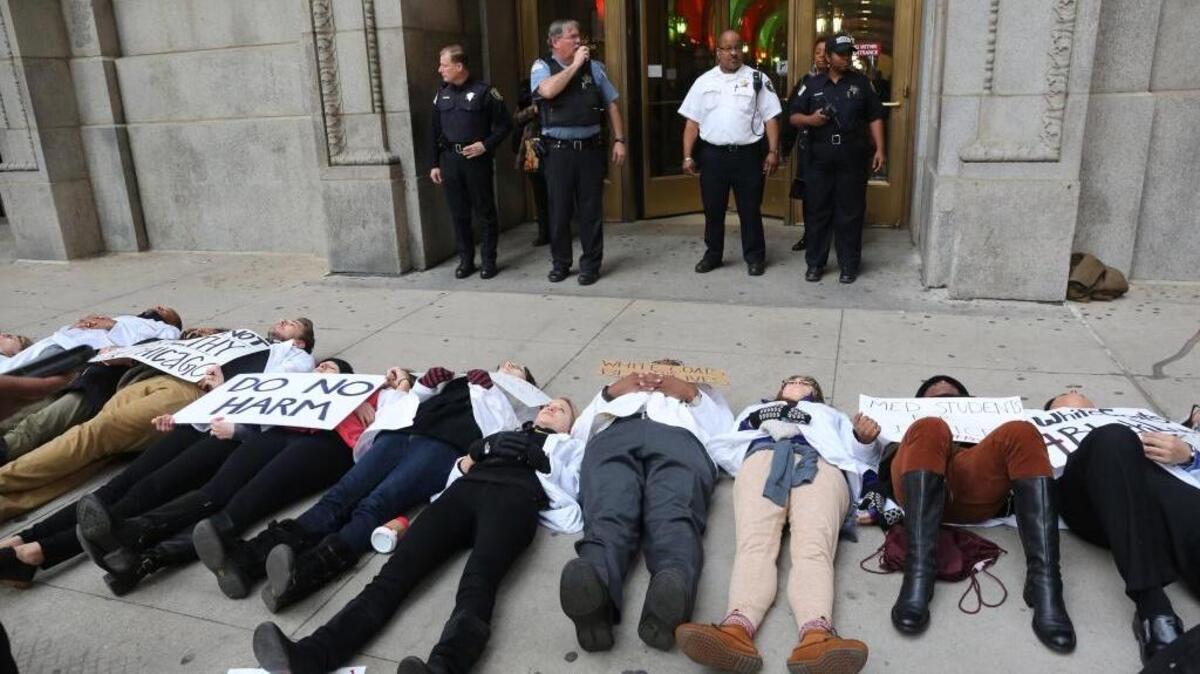Medical students stage a “die in” outside the Cook County building in Chicago to protest the killing of Laquan McDonald by a police officer in Chicago.