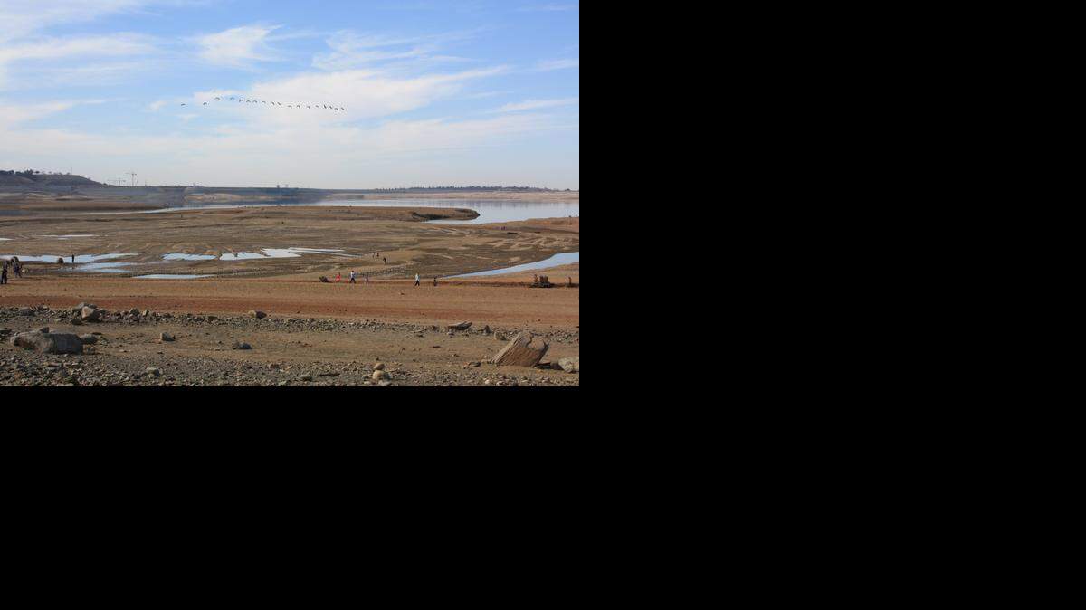 
Tree stumps, boulders and rocks normally covered by Folsom Lake lay exposed by two years of drought. Being able to see the front of Folsom dam in the distance gave an eerie feeling to the landscape.
