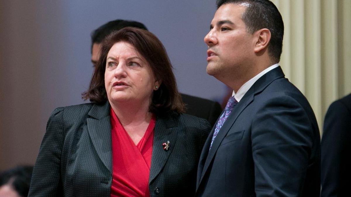 State Sen. Toni Atkins, D-San Diego, left, talks with Sen. Ricardo Lara, D-Bell Gardens. The California Senate last week passed their $400 billion plan for single-payer health care.