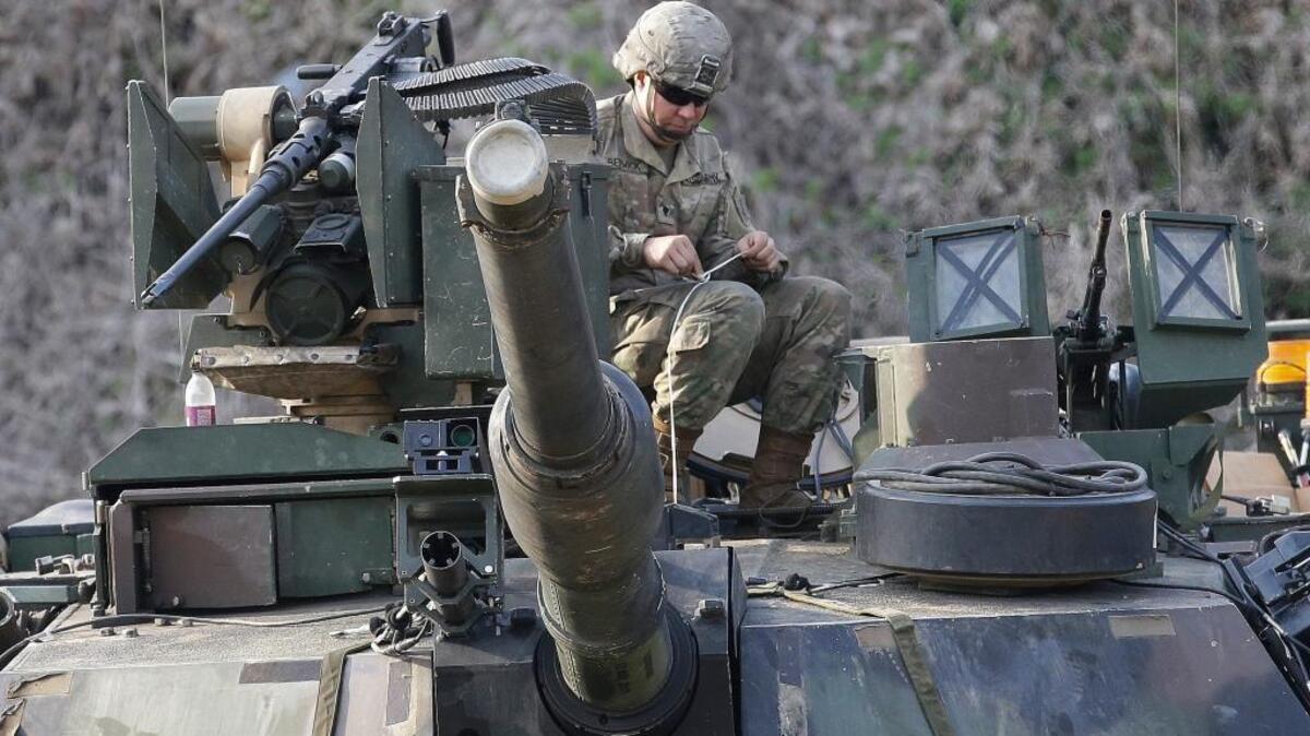 A U.S. Army soldier works on a M1A2 tank during a military exercise in Paju, South Korea, near the border with North Korea, on April 21.