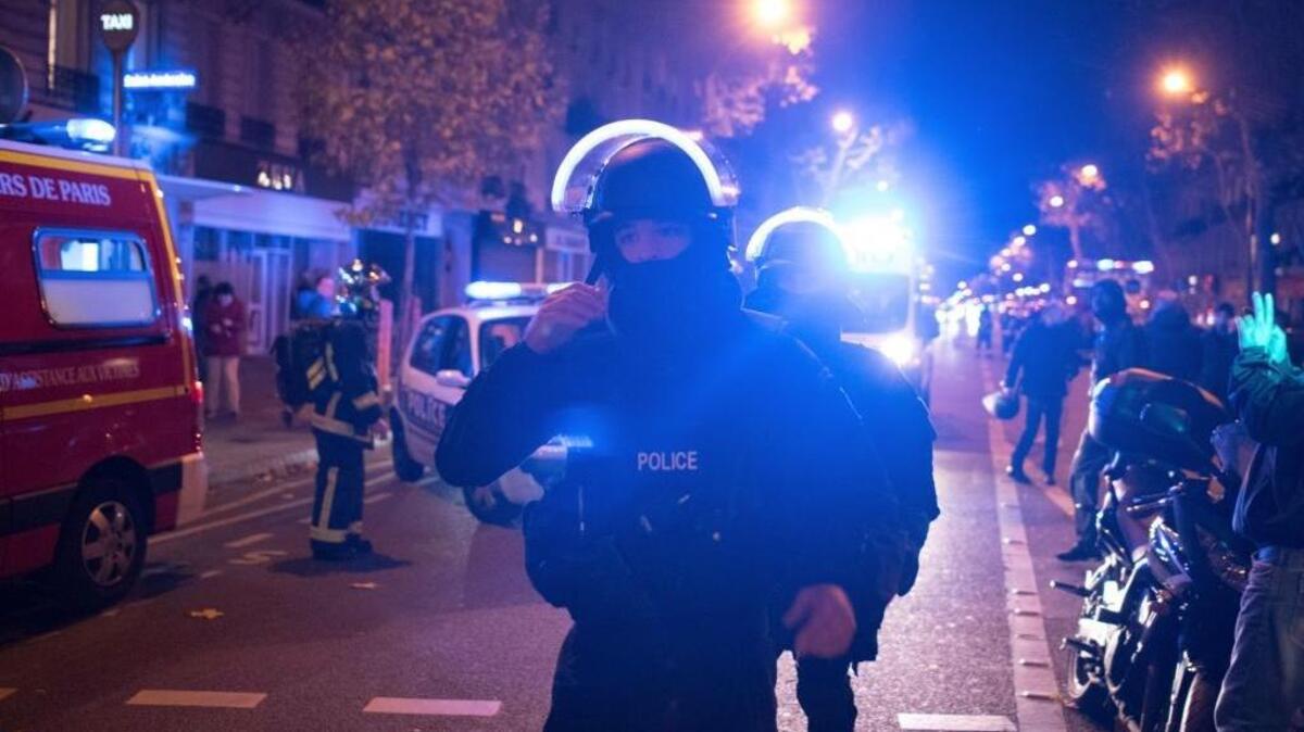 Elite police officers arrive Friday night outside the Bataclan theater, one of several places in Paris hit in a series of terror attacks.