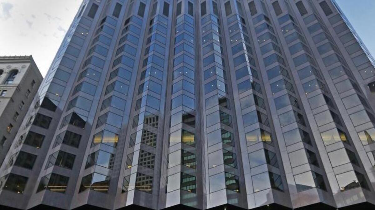 Protesters in San Francisco rally at 555 California St., a partially Trump-owned building.