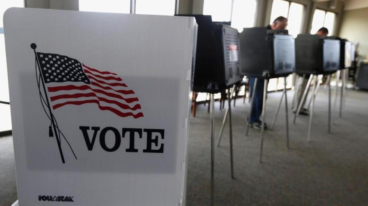 Voters cast their ballots in this 2014 file photo. The results of the 2020 Census determine how many members voters in each state get to represent them in the House of Representatives.