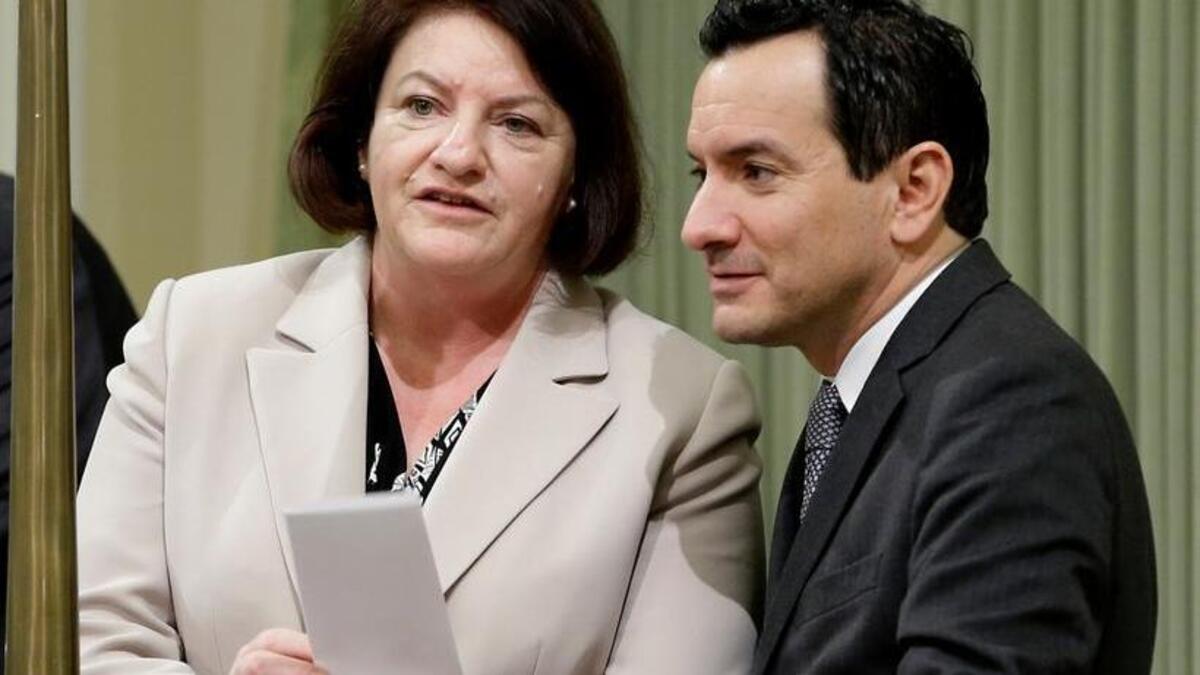 Assembly Speaker Toni Atkins, D-San Diego, talks with Assemblyman Anthony Rendon, D-Lakewood, as lawmakers debate a package of bills aimed at restricting access to tobacco on Thursday. Rendon was sworn in as the new Assembly speaker on Monday, replacing Atkins, who will be termed out of office at the end of this year’s legislative session.