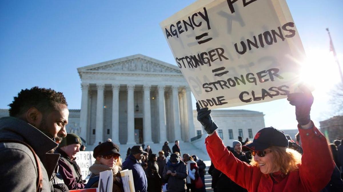 Protestors rally as the Supreme court hears arguments in the case of Friedrichs v. California Teachers Association.