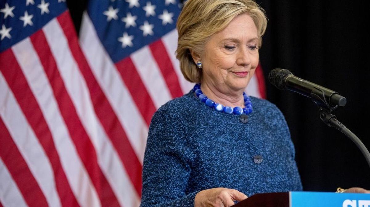 Democratic presidential candidate Hillary Clinton pauses while speaking at Theodore Roosevelt High School in Des Moines, Iowa on Friday.