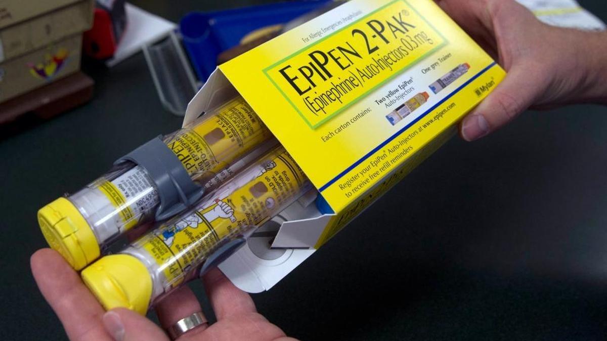 A pharmacist holds a package of EpiPens, made by the pharmaceutical company Mylan. CEO Heather Bresch will testify before the House Oversight and Government Reform Committee in the coming days after Mylan jacked up the price for the lifesaving drug by more than 500 percent since 2007.