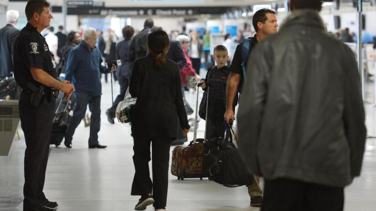 The recent attacks in Paris and the State Department worldwide travel alert have raised security awareness at places like Charlotte Douglas International Airport, above.