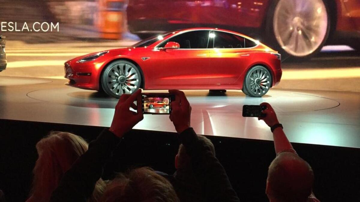 The electric Tesla Model 3 sedan, shown at the company’s design studio in Hawthorne in March, goes on sale next year. California promises up to $2,500 to people who buy electric cars and plug-in hybrid vehicles. In recent years, the state has used cap-and-trade revenue to fund the rebate program. But in part because of legislative inaction, cap-and-trade faces an uncertain future, and rebates are on hold as a result.