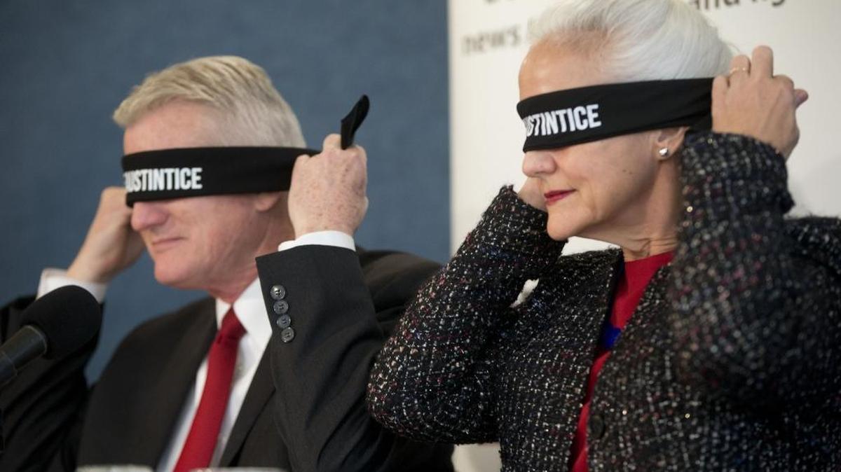 Debra and Marc Tice, the parents of missing journalist Austin Tice, blindfold themselves at a National Press Club event last year to raise awareness.