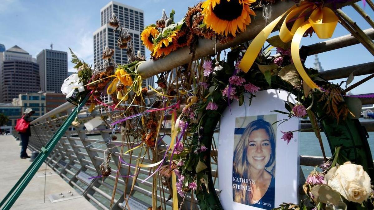Flowers and a portrait of Kate Steinle remain at a memorial site on Pier 14 in San Francisco in July 2015.