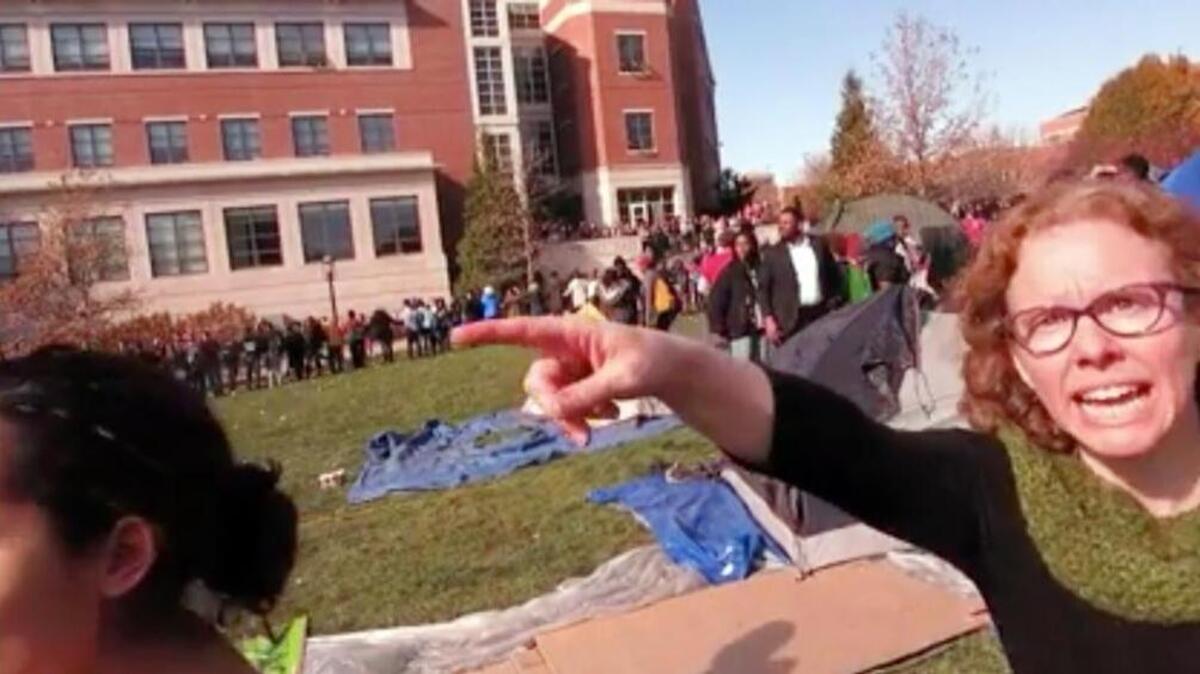 Melissa Click, a professor in Missouri's communications department, confronts a journalist and calls for "muscle" to help remove him from a protest on campus at the University of Missouri. Late Tuesday, she resigned a courtesy appointment from the university’s school of journalism.