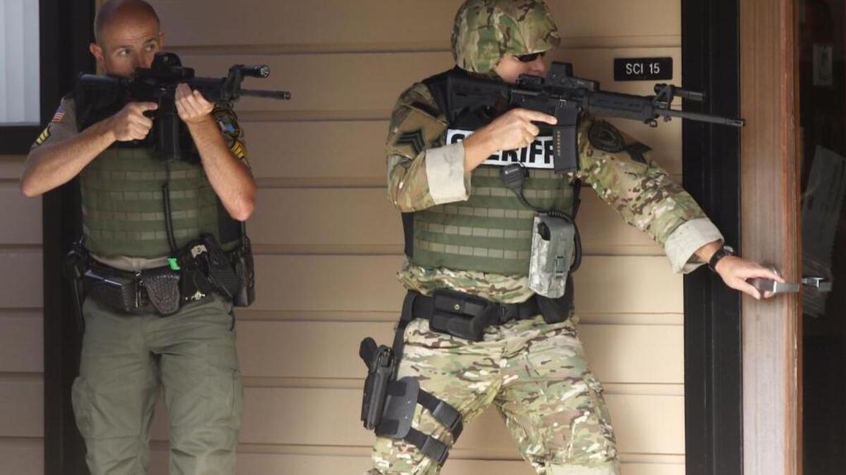 
Officers respond Thursday to a report of a shooting at Umpqua Community College in Roseburg, Ore.
