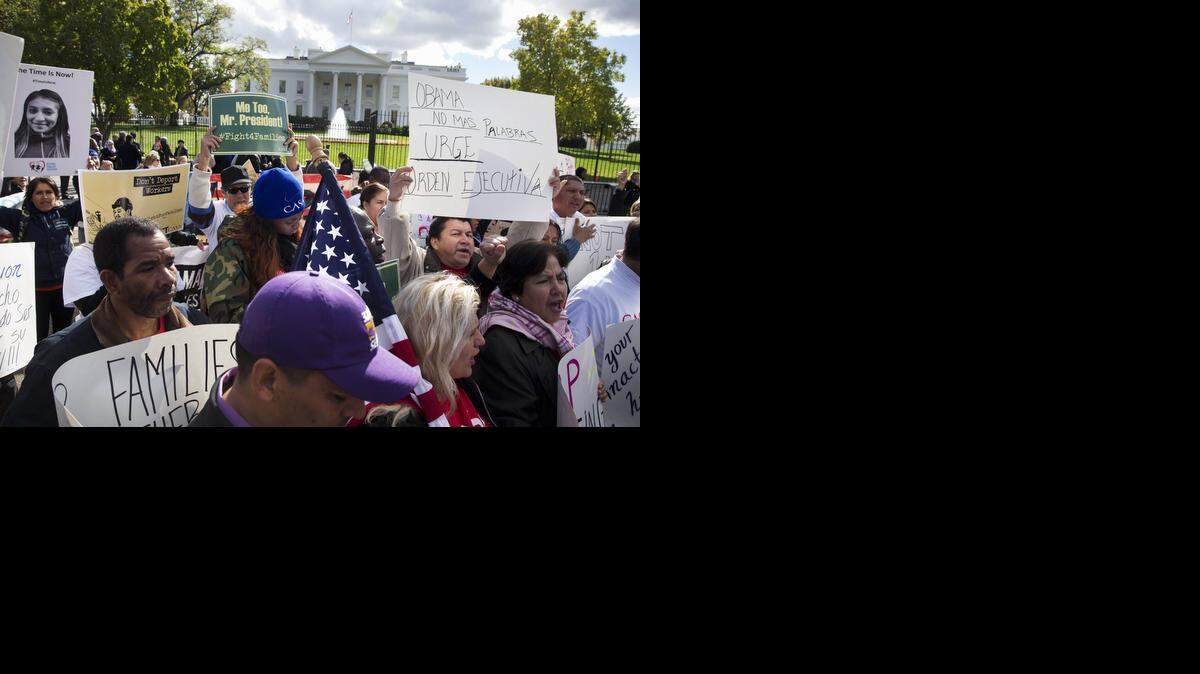 
People rally for comprehensive immigration reform outside the White House in Washington on Nov. 7. According to advocates in touch with the White House, President Barack Obama is poised to act soon to unveil a series of executive actions on immigration that will shield possibly around 5 million immigrants living in the country illegally from deportation. Timing of the announcement is unclear, though it's expected before the end of 2014. 
