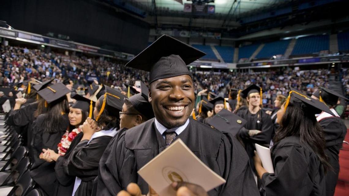 Communications studies major Slynar Zelee smiles after degrees were conferred during a Sacramento State graduation ceremony in 2012.