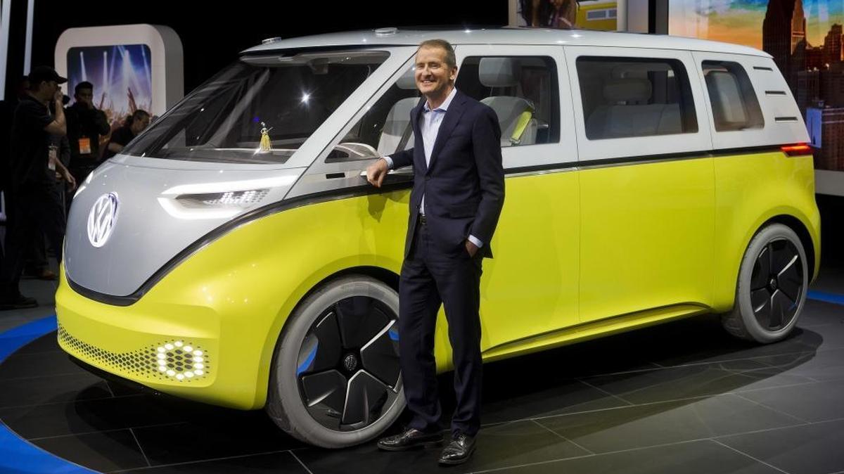 Herbert Diess, chairman of Volkswagen, poses with the I.D. Buzz all-electric concept van at the North American International Auto Show in January 2017 in Detroit.