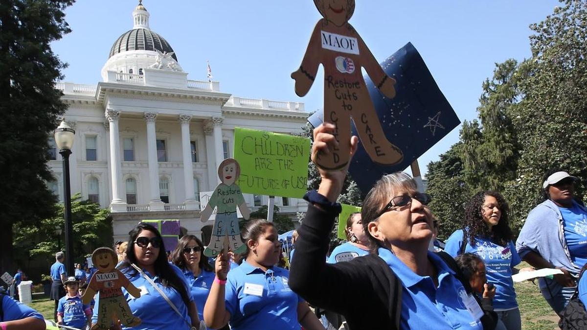 Demonstrators like these at a rally last year outside the Capitol have been calling for several years for child care funding to be restored.