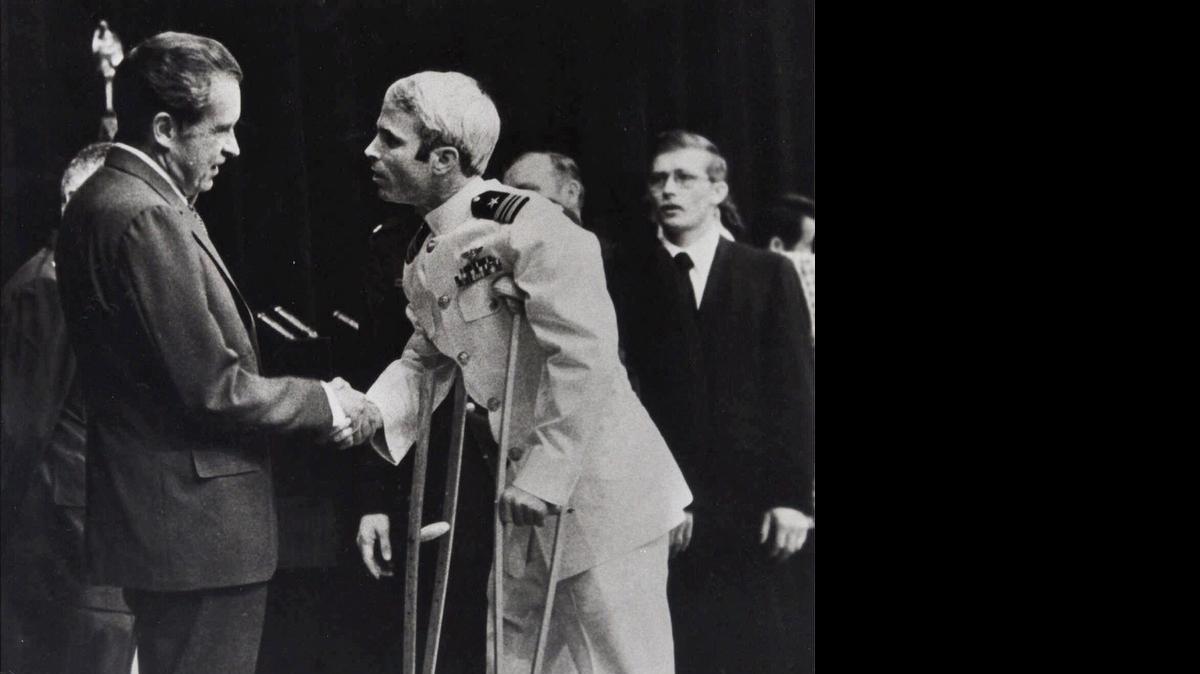 
John McCain, right, is greeted by President Richard Nixon after arriving in Washington in 1973 after captivity in Vietnam. Republican presidential candidate Donald Trump has criticized McCain’s military record.
