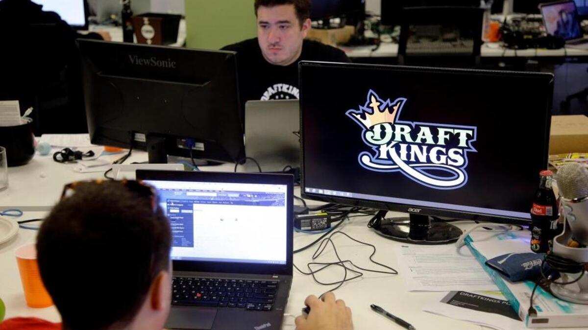 
Len Don Diego, marketing manager for content at DraftKings, a daily fantasy sports company, works at his station at the company’s offices in Boston. New York’s attorney general has sent letters to daily fantasy sports websites DraftKings and FanDuel demanding they turn over details of any investigations into their employees.
