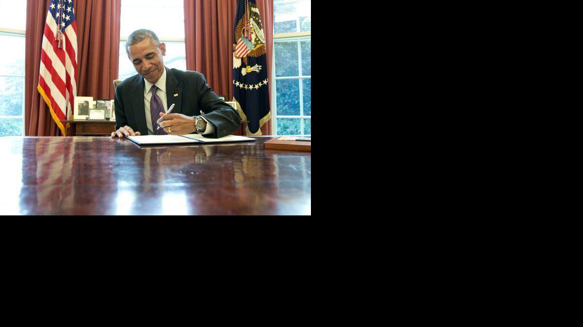 
President Barack Obama signs a presidential memorandum in January advancing a paid family leave for federal workers. Inspired by California, he has called for similar programs throughout the United States. 
