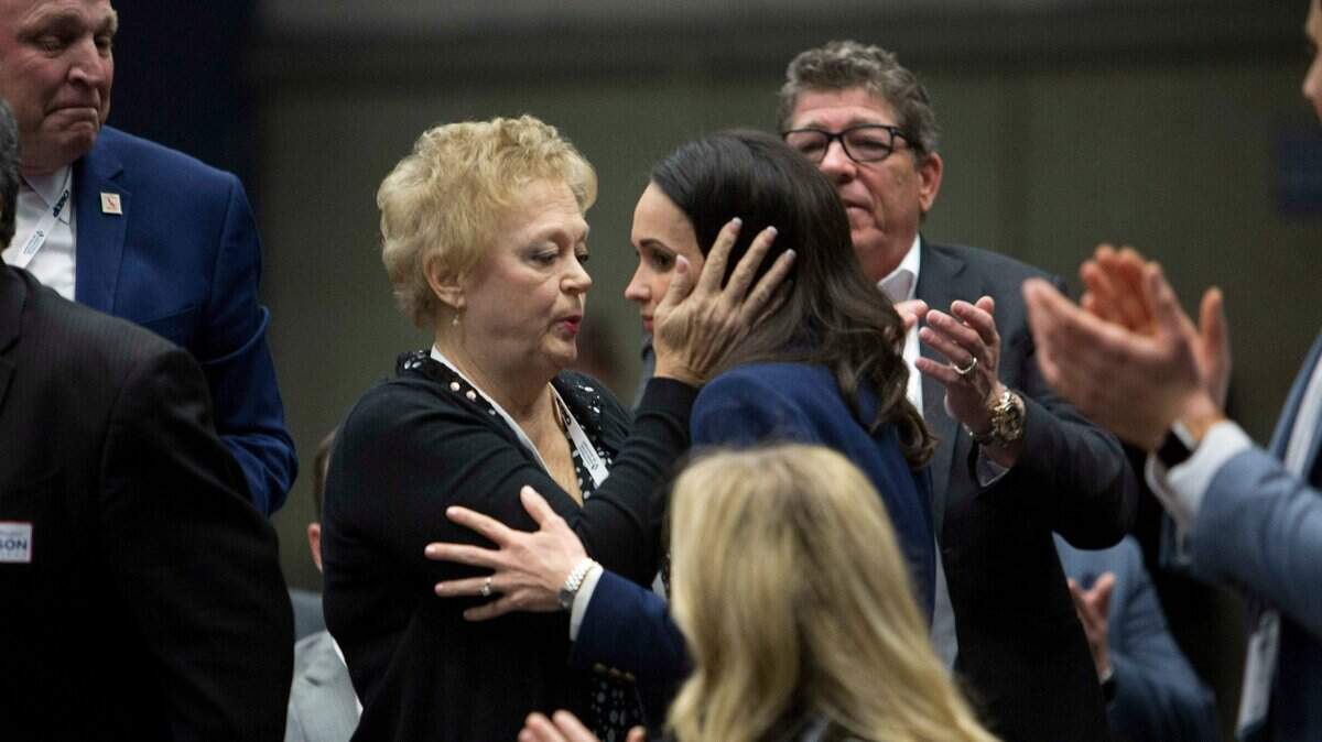 Jessica Patterson, right, shares a moment with her mother Julie Millan, after being nominated for chair of California Republican Party during their convention in Sacramento, Calif., Saturday, Feb. 23, 2019. (AP Photo/Steve Yeater)