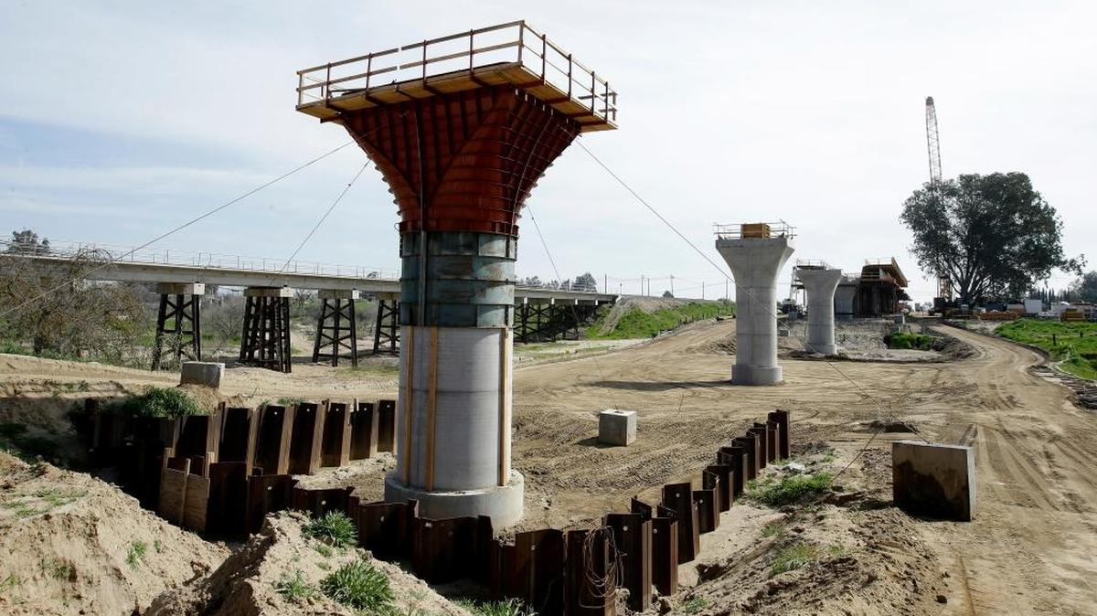 In this Feb. 26, 2016, file photo, the supports for a 1,600-foot-viaduct to carry high-speed rail trains across the Fresno River are seen under construction near Madera, Calif. After years of prep work, Gov. Jerry Brown's finance department decided Friday, March 3, 2017, that California's $64 billion high-speed rail project is ready to lay some track. The administration approved the rail authority's request to spend $2.6 billion on work in the Central Valley. The decision lets the authority ask the state treasurer's office to sell a portion of the nearly $10 billion in bonds voters approved in 2008 for a bullet train.