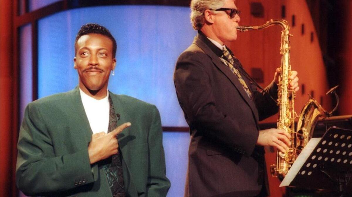 
Bill Clinton plays the saxophone during a campaign stop on “The Arsenio Hall Show” in Los Angeles in June 1992. 
