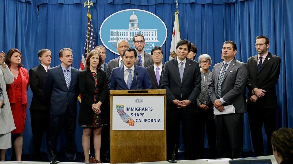 Assembly Speaker Anthony Rendon, D-Paramount, center, discusses a pair of proposed measures to protect immigrants, during a news conference in Sacramento on Monday. The lawmakers urged President-elect Donald Trump to refrain from pursuing mass deportations and introduced legislation to fund immigration lawyers and help public defenders protect the state’s immigrants.