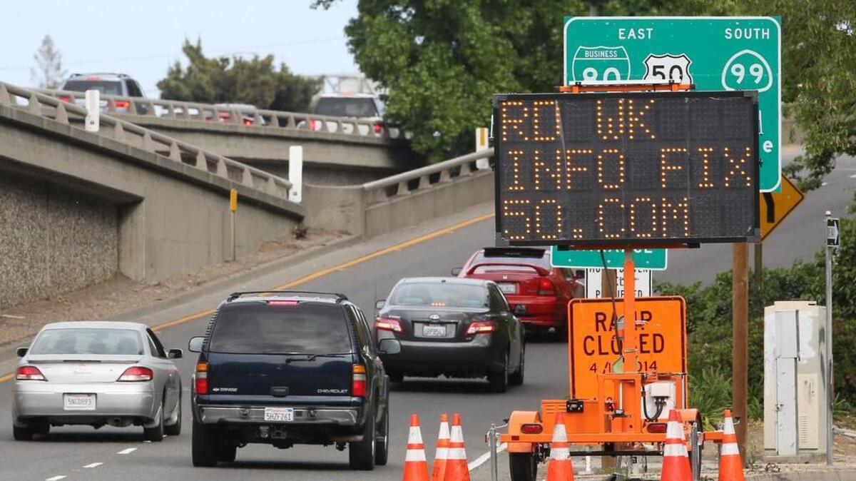 
A sign shows where to get information about the pending work on the freeway in Sacramento. 
