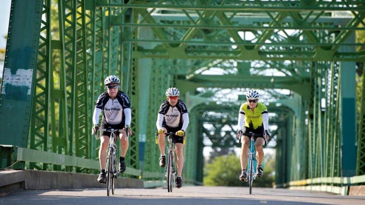 FILE -- Dan Gorfain, 70, left, and his cycling pals Howard Sarasohn, 72, middle, and Dave Brubaker, 68, ride across the Jibboom Street Bridge on Tuesday, July 23, 2013 in Sacramento, Calif. The bridge is closed for the next six months for repair, leading to detours.