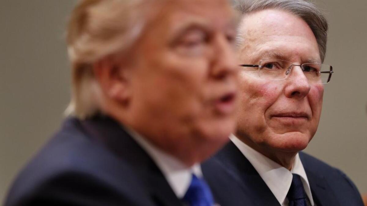 National Rifle Association Executive Vice President and Chief Executive Officer Wayne LaPierre, at right, listens as President Donald Trump speaks in the White House. More research could reduce U.S. firearms fatalities, a letter writer suggests.