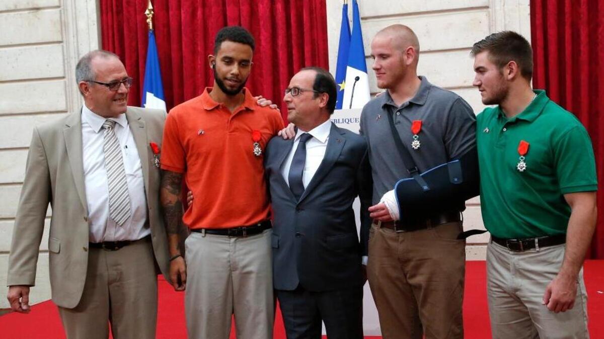 
French President Francois Hollande, center, awarded medals of the Legion of Honor to, from left, British businessman Chris Norman, Anthony Sadler, Spencer Stone and Alek Skarlatos.
