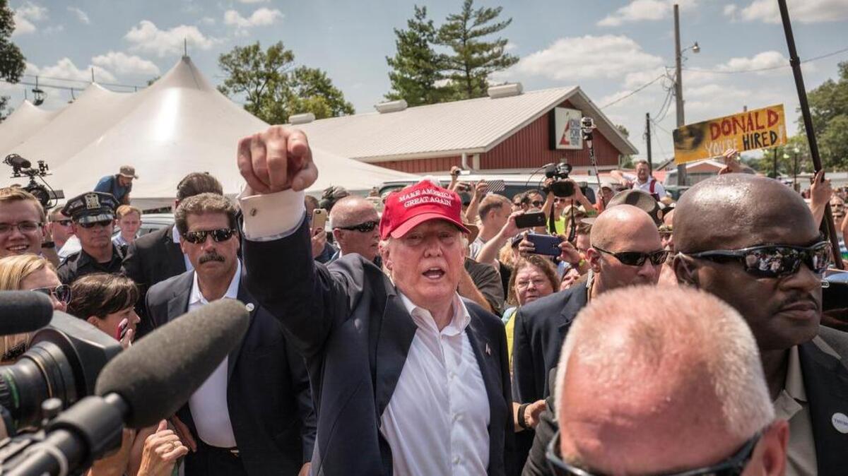 
Donald Trump waves to the crowd at the Iowa State Fair on Aug. 15. 
