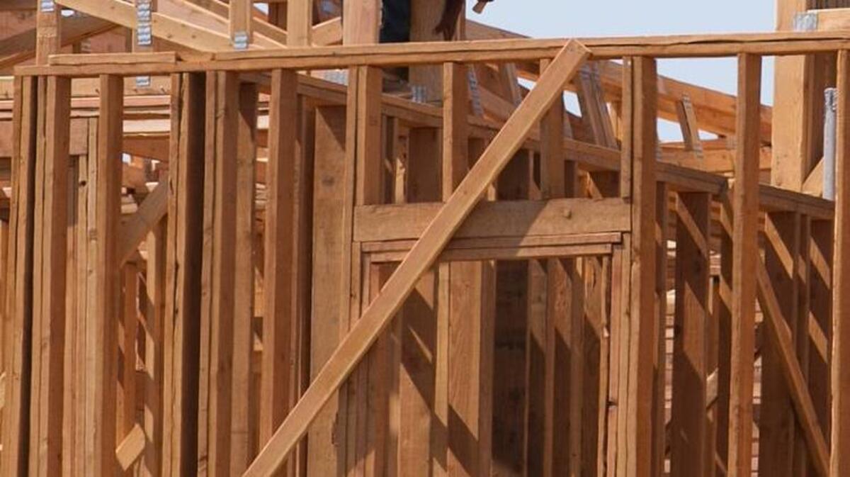 In this photo taken Friday, Aug. 18, 2017, a builder works on an apartment complex in Sacramento, Calif. Gov. Jerry Brown and Democratic legislative leaders promised to tackle California's housing crisis in the final weeks of the legislative session by pushing a package that includes money for low-income housing and regulatory reforms.