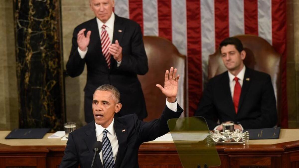 President Barack Obama waves goodbye after giving his final State of the Union address before a joint session of Congress on Capitol Hill on Tuesday. Vice President Joe Biden applauds and House Speaker Paul Ryan remains seated.