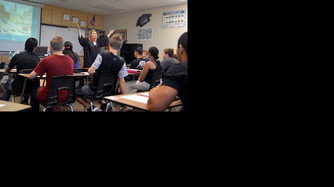 
Enochs High history teacher Janeen Zambo, wearing a graduation robe for the campus College Day, gives a Common Core lesson on the Declaration of Independence in her U.S. history class in Modesto. Letter writers debate the benefits of Common Core.
