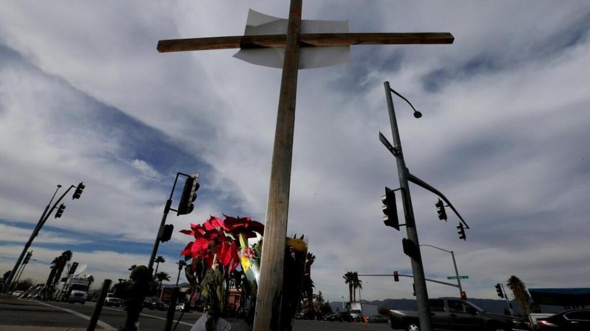 A makeshift memorial stands at a San Bernardino street corner the day after a mass shooting claimed 14 lives at the nearby Inland Regional Center.