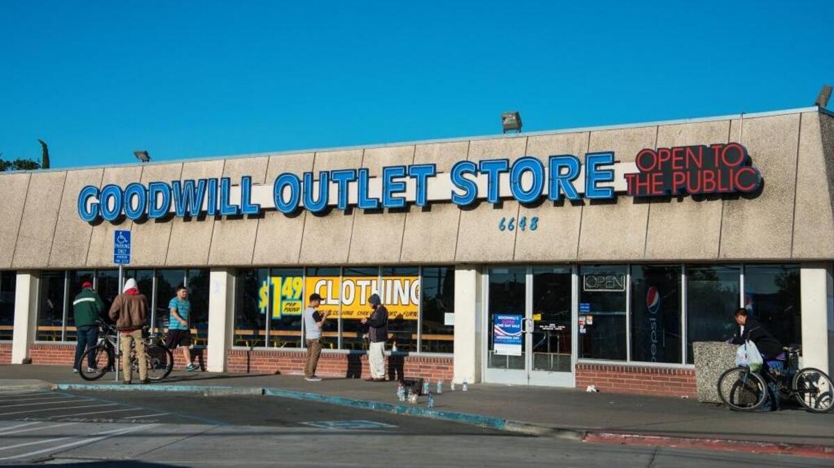 People line up at the Goodwill Outlet Store on Franklin Boulevard in Sacramento on May 13.