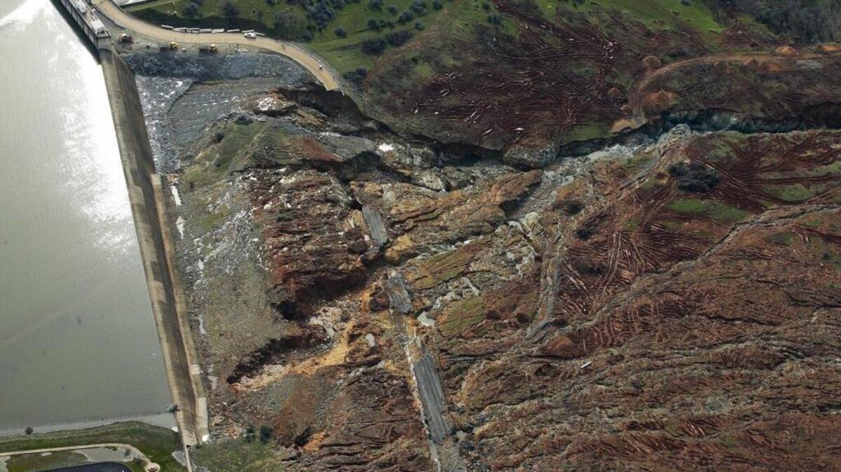 This photo shows erosion caused when overflow water cascaded down the emergency spillway of the Oroville Dam. The water level dropped Monday at the nation’s tallest dam, easing slightly the fears of a catastrophic spillway collapse that prompted authorities to order people to leave their homes downstream.