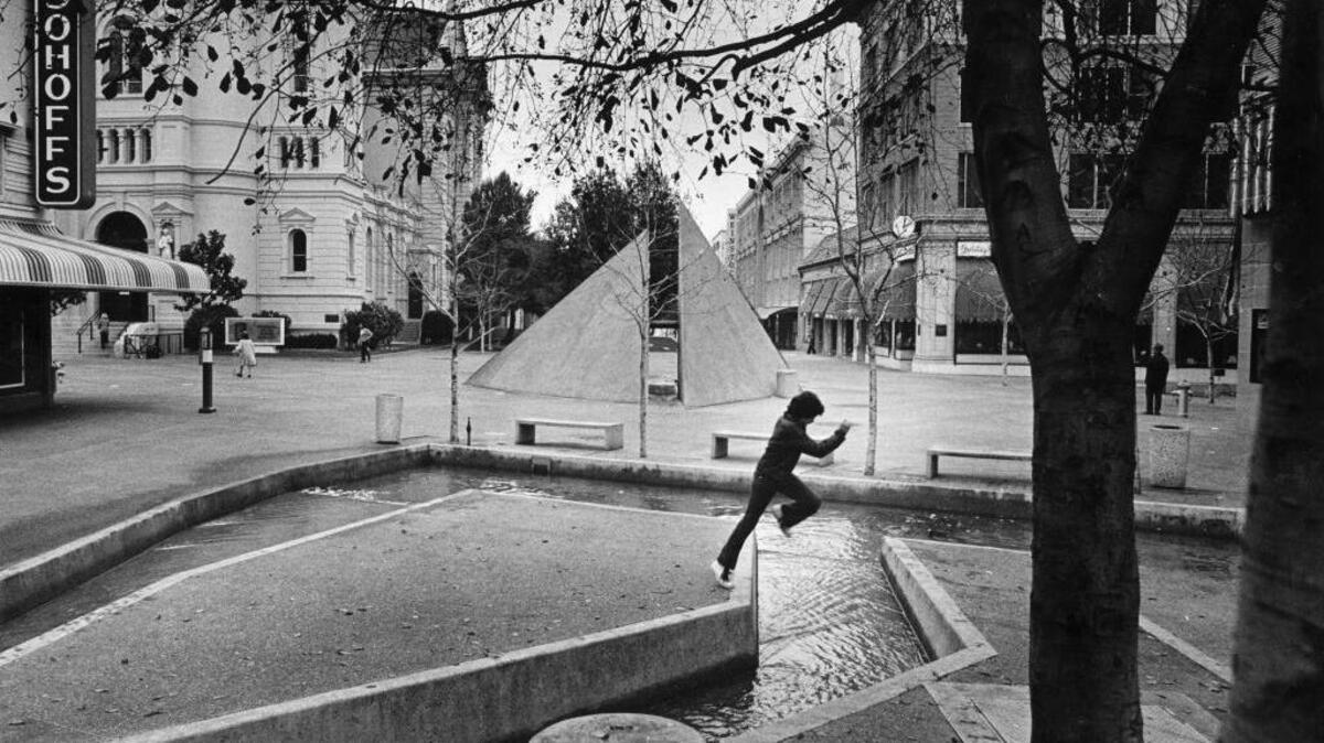 A child pays on the water structures of the K Street Mall in 1978.