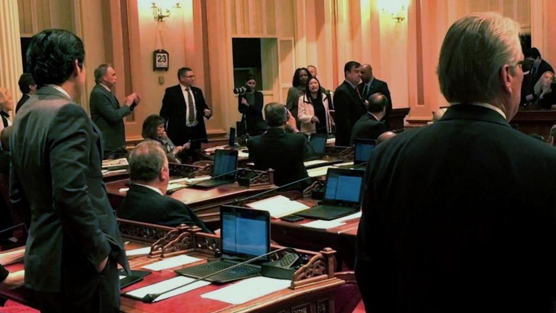 An image made from a mobile video shows Sen. Janet Nguyen being removed from the Senate floor on Feb. 23 after refusing to stop delivering a speech criticizing the late state Sen. Tom Hayden.