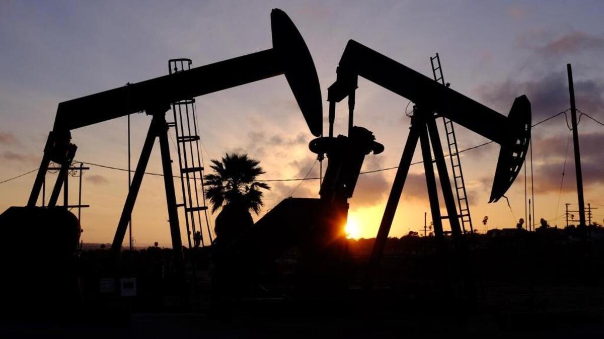 The sun sets behind pumpjacks operating at the Inglewood oil fields in the Baldwin Hills area of Los Angeles. Letter writers discuss the effects of oil companies fighting passage of state Senate Bill 350, the Clean Energy and Pollution Reduction Act.